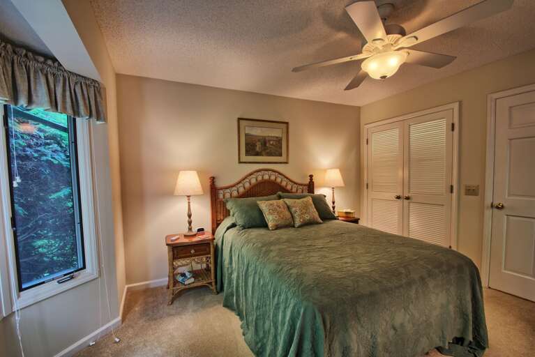 Main level bedroom with queen bed