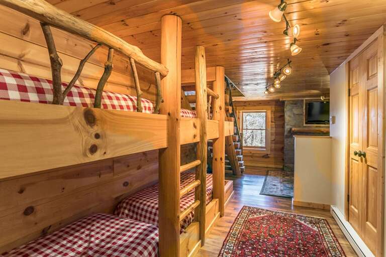 Lower level room with two sets of twin bunks