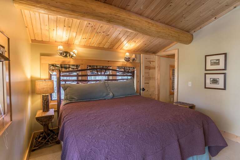 Upper level bedroom with king bed