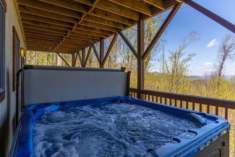 Outdoor Jacuzzi On Covered Deck With Scenic View