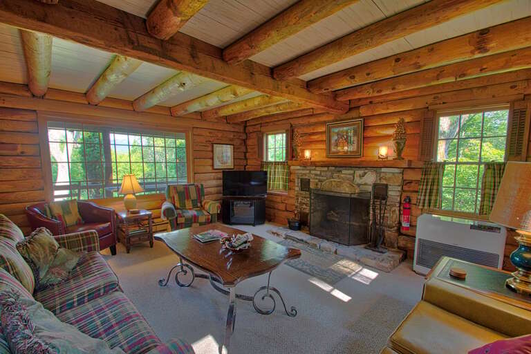 Enjoy an evening glass of wine in front of the fire place Enjoy an evening glass of wine in front of the fire place