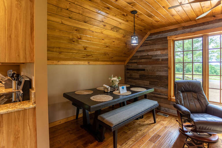 Wooden Interior Of Vacation Rental With Dining Table And Recliner Wooden Interior Of Vacation Rental With Dining Table And Recliner
