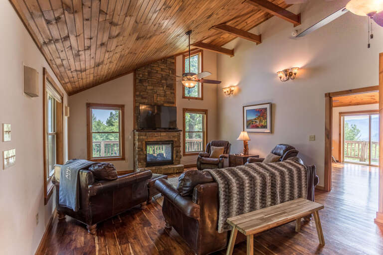 Rustic Living Room Interior With Fireplace And Hardwood Floors