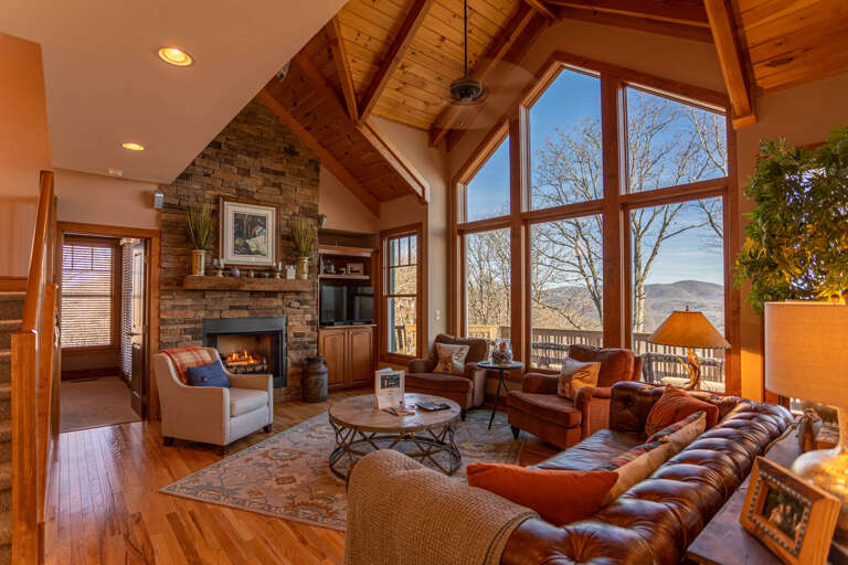 Vacation Rental Living Room With Fireplace And Large Windows