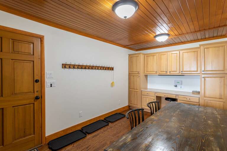 Entry room between garage and kitchen, racks for coats or skis. Entry room between garage and kitchen, racks for coats or skis.