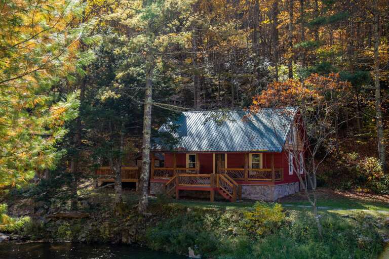 Cabin In Forest By River