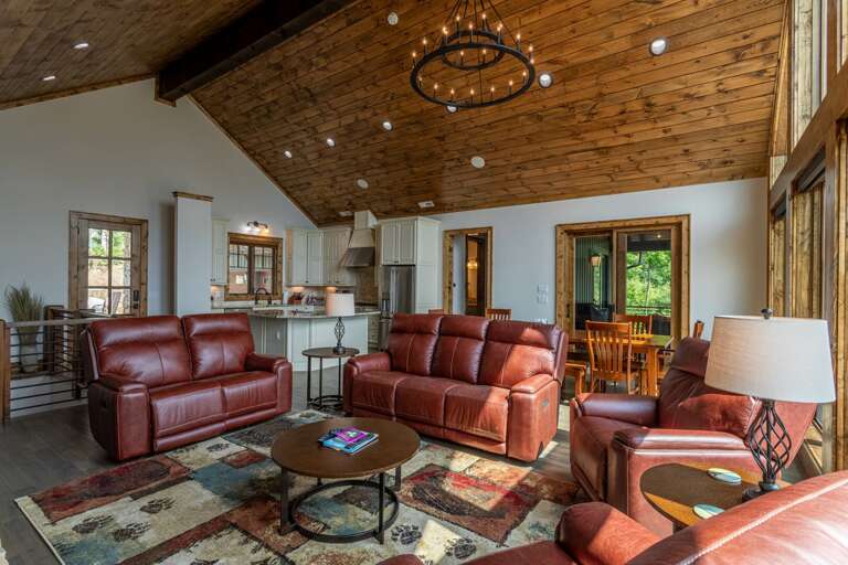 Rustic-style Living Room With Leather Sofas And Wooden Ceiling Rustic-style Living Room With Leather Sofas And Wooden Ceiling