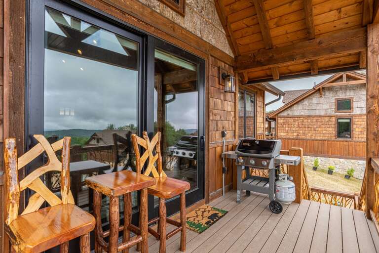 Back deck with view, laurel branch railings, gas grill, steps to hot tub