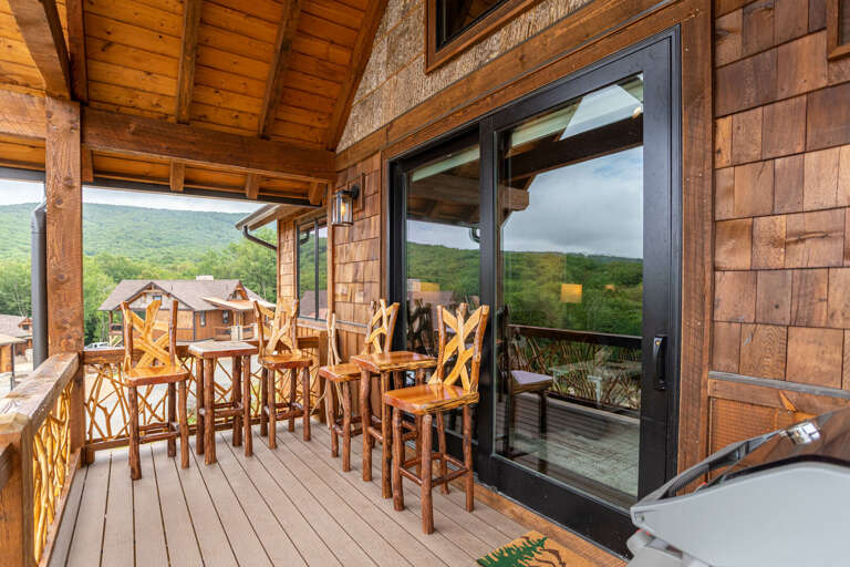 Back deck with view, laurel branch railings, gas grill, steps to hot tub
