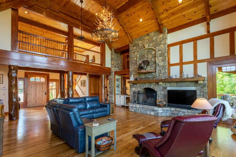 Rustic Living Room Interior With Fireplace And Wood Beam Ceiling