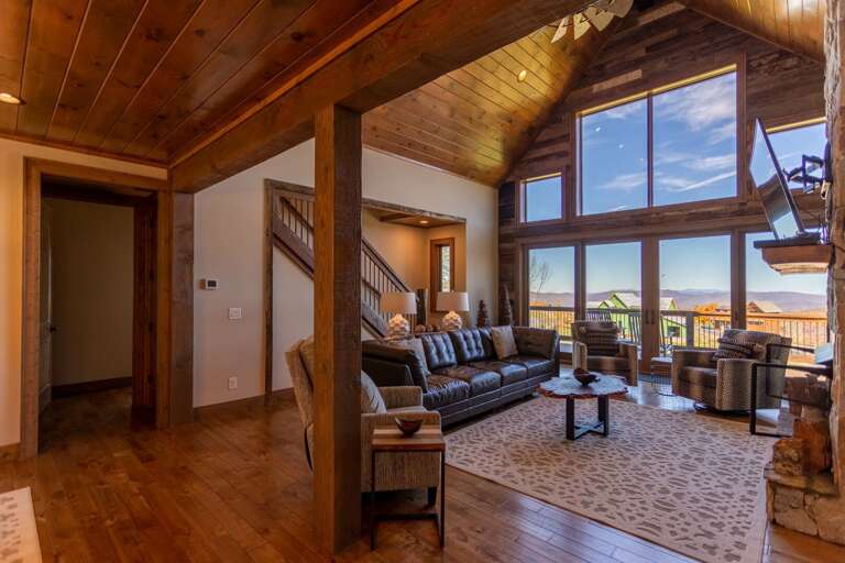 Interior Of A Vacation Rental Living Room With Sofas And Large Windows