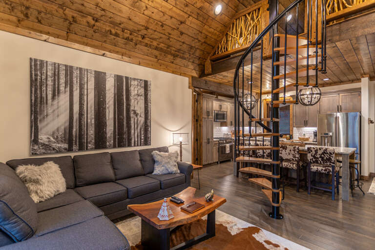 Rustic Interior With Living Space And Spiral Staircase