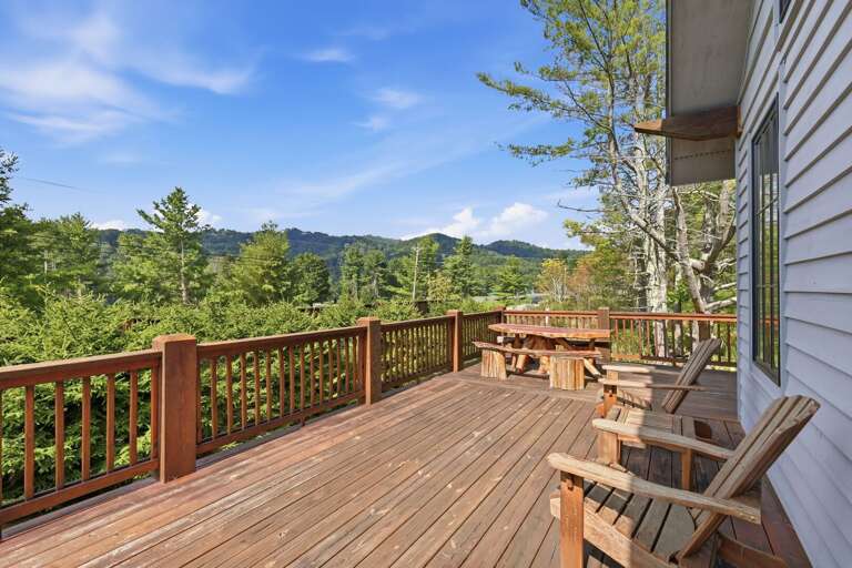 Kick back on the sunny deck at Banner Sky, where Adirondack chairs and a picnic table sit ready for crisp Blue Ridge afternoons.