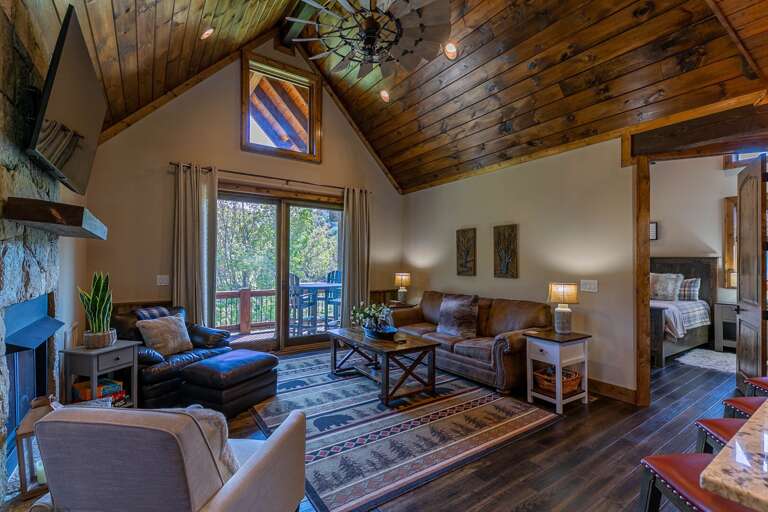 Rustic Living Room Interior With Vaulted Ceiling And Fireplace Rustic Living Room Interior With Vaulted Ceiling And Fireplace