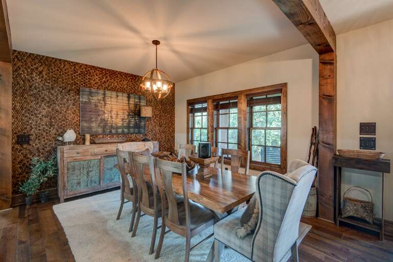 Rustic Dining Room With Wooden Table And Patterned Wallpaper