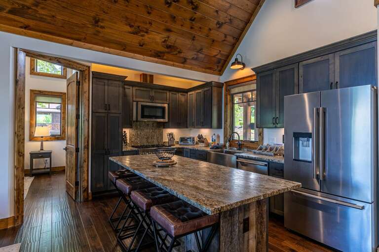 Rustic Kitchen With Wooden Ceiling And Stone Countertop Rustic Kitchen With Wooden Ceiling And Stone Countertop