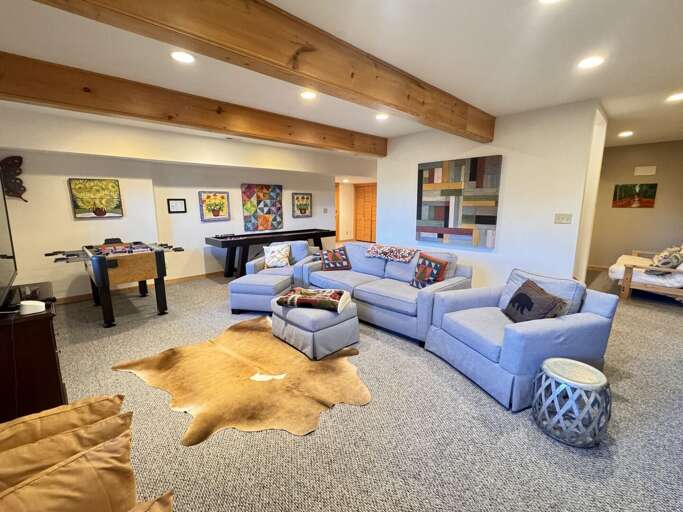Room for everyone to play. The lower level at Angels Envy brings together a ping-pong table, shuffleboard, foosball, and a sprawling sectional under warm wood beams.