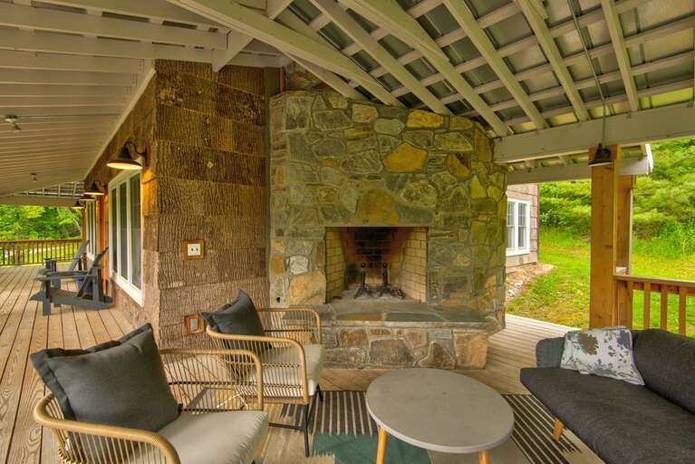 Outdoor Sitting Area With Fireplace And Furniture