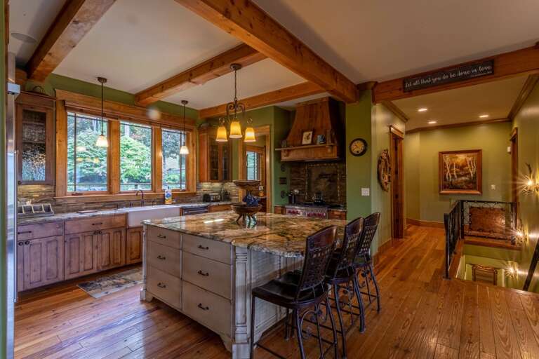 Fully stocked kitchen with gas range, double oven, dishwasher and walk in pantry.