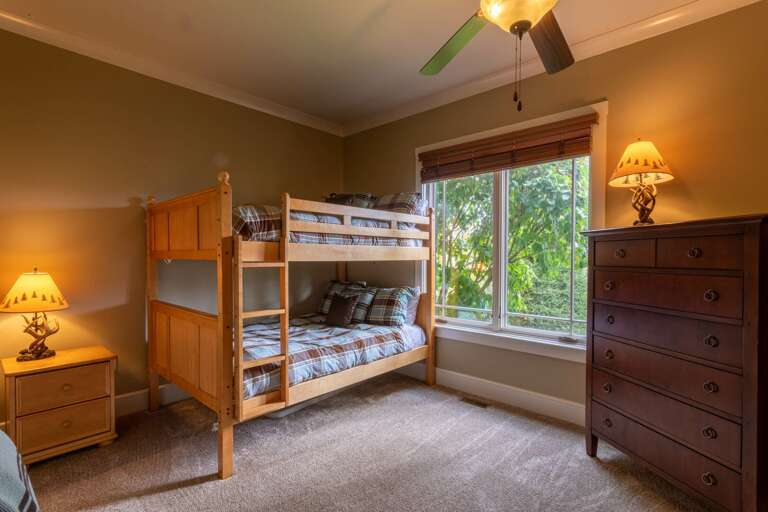 Lower level bunk room with queen top and bottom bunks.