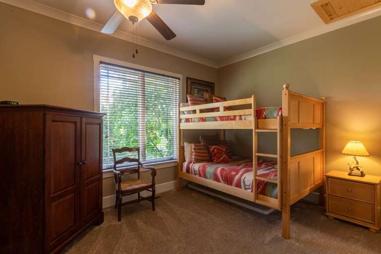 Lower level bunk room with queen top and bottom bunks.