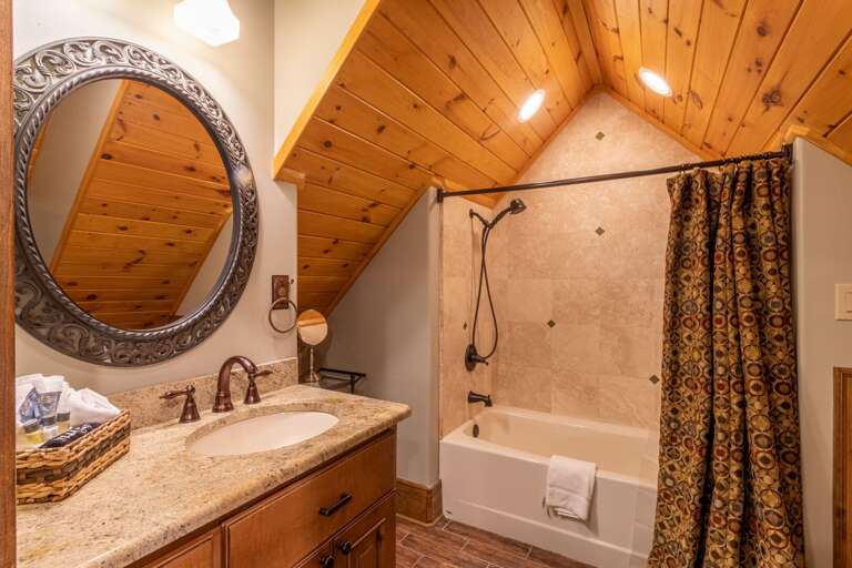 Upper level full bathroom with shower/tub combo.