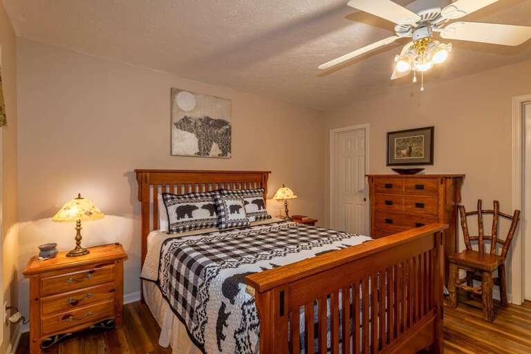 Main level bedroom with queen bed