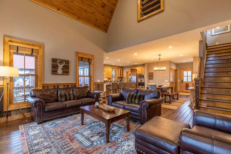 Interior Of A Vacation Rental Living Room With Kitchen In The Background