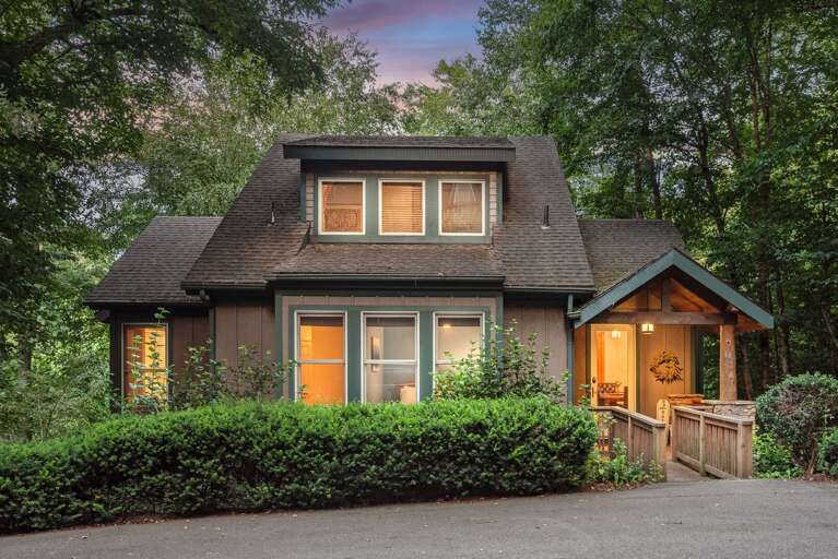 House Surrounded By Trees At Dusk