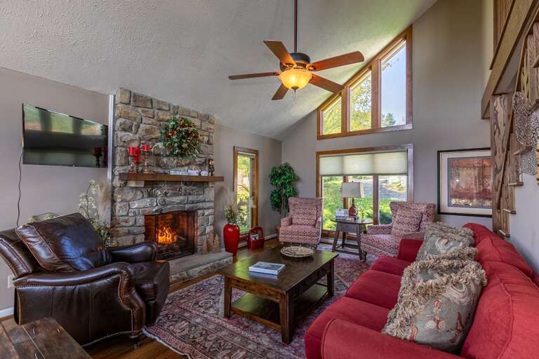 Living Room With Fireplace And Red Sofa
