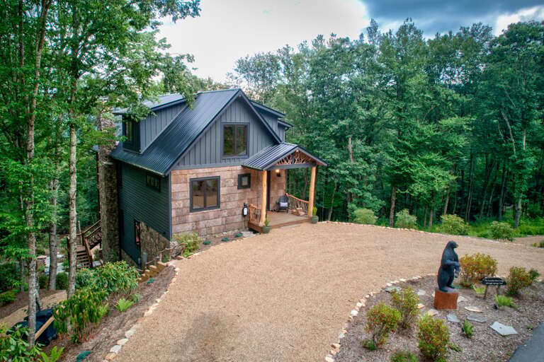 Rustic House Surrounded By Trees With A Gravel Driveway Rustic House Surrounded By Trees With A Gravel Driveway
