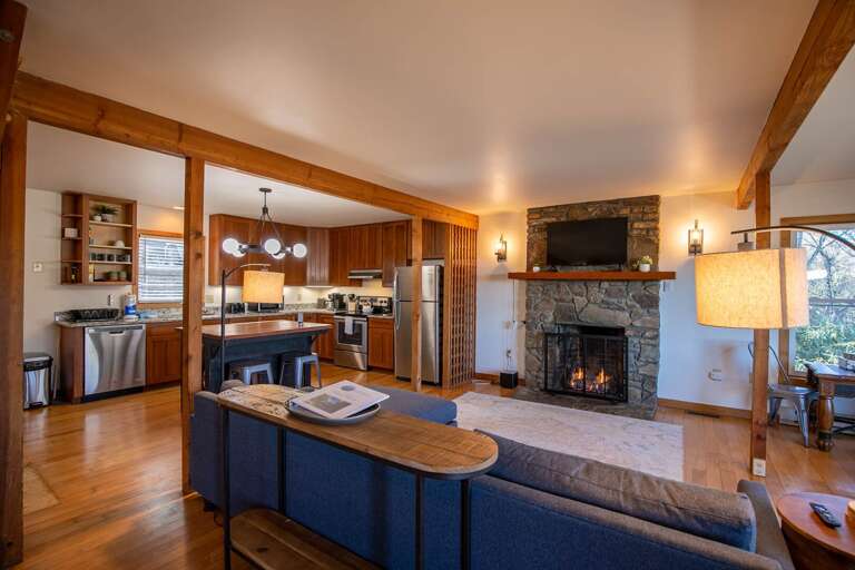 Living Room With Kitchen View And Fireplace