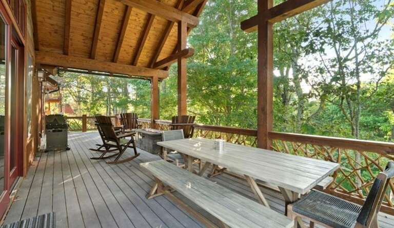 Wooden Terrace With Bench-style Seating And Forest View
