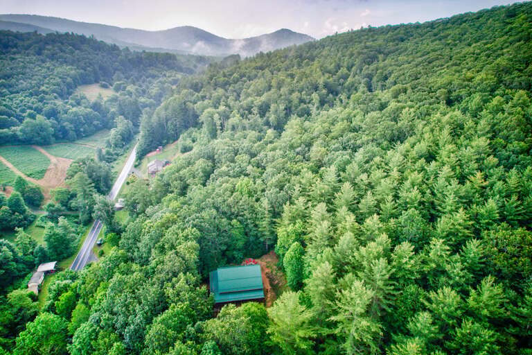 Aerial View Of A Secluded House Surrounded By Forest Aerial View Of A Secluded House Surrounded By Forest