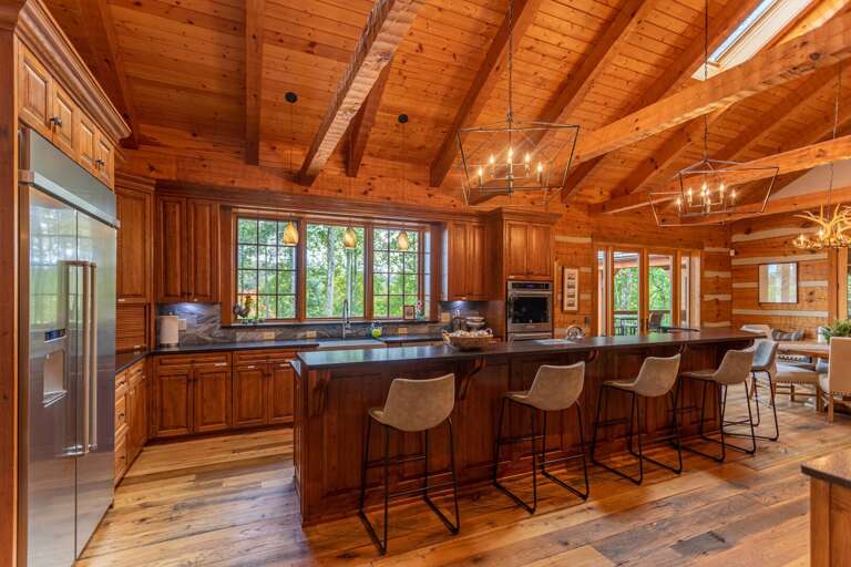 Fully stocked kitchen with formal dining area and kitchen bar.
