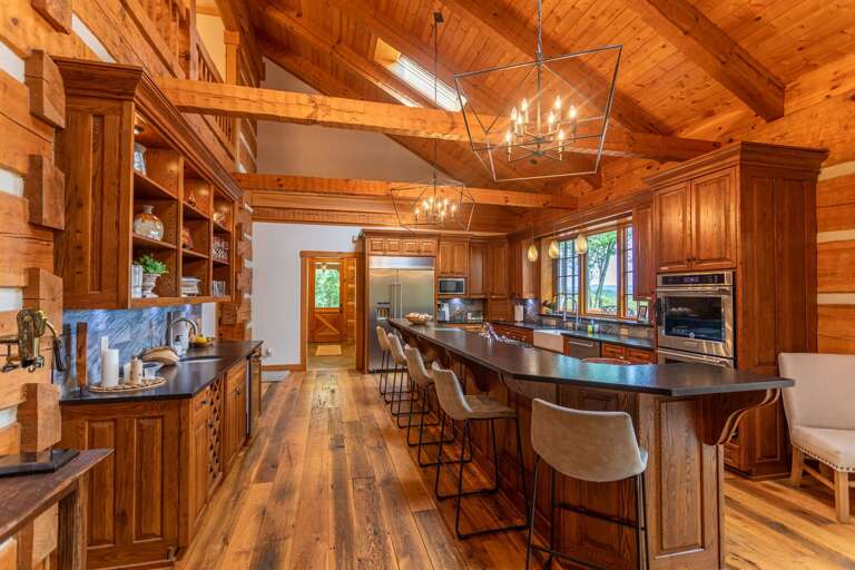 Fully stocked kitchen with formal dining area and kitchen bar.