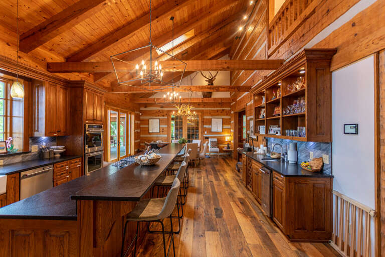 Fully stocked kitchen with formal dinning area and kitchen bar.