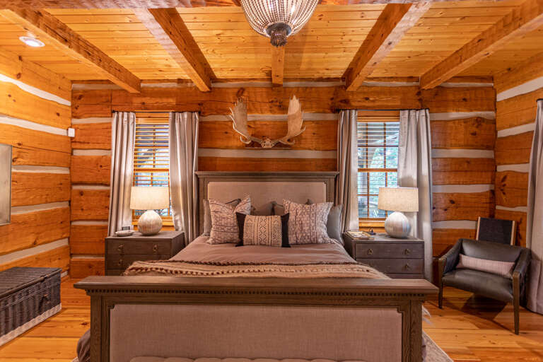 Main level master bedroom with king bed and full bathroom.