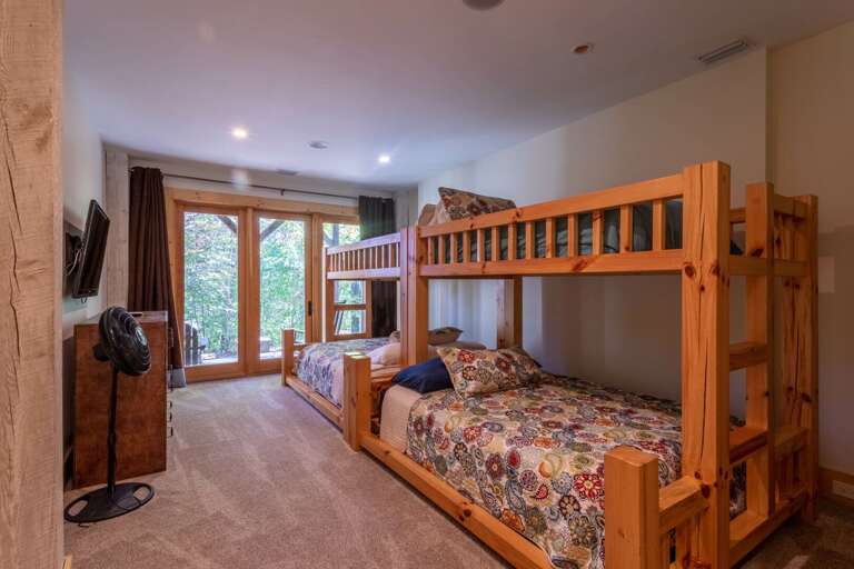 Lower level bunkroom with queen bottoms and twin tops. Lower level bunkroom with queen bottoms and twin tops.