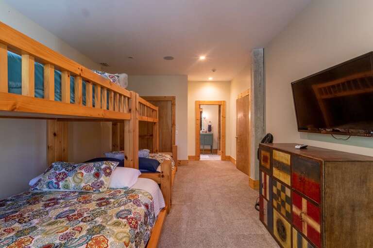 Lower level bunkroom with queen bottoms and twin tops. Lower level bunkroom with queen bottoms and twin tops.
