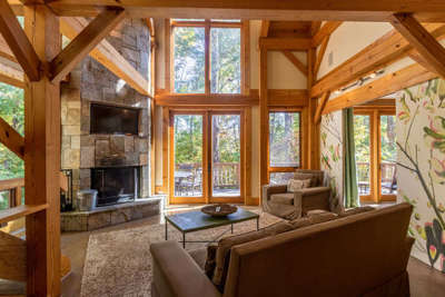 Main level living room with wood burning fireplace.