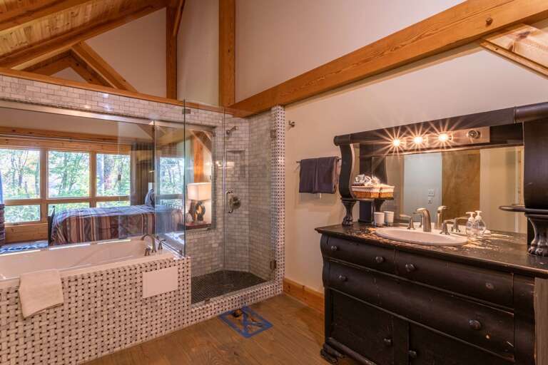 Upper level master bedroom bathroom with jacuzzi tub and standing shower. Upper level master bedroom bathroom with jacuzzi tub and standing shower.