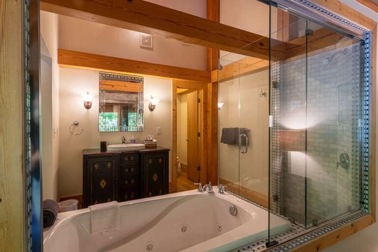 Upper level master bedroom bathroom with jacuzzi tub and standing shower. Upper level master bedroom bathroom with jacuzzi tub and standing shower.