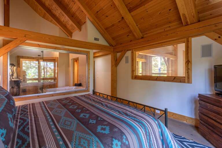 Upper level master bedroom with king sized bed, full bathroom and walk in closet. Upper level master bedroom with king sized bed, full bathroom and walk in closet.