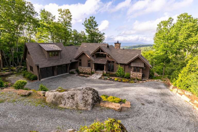 Rustic Residence Nestled In Nature, Beneath Blue Skies, Surrounded By Serene Scenery