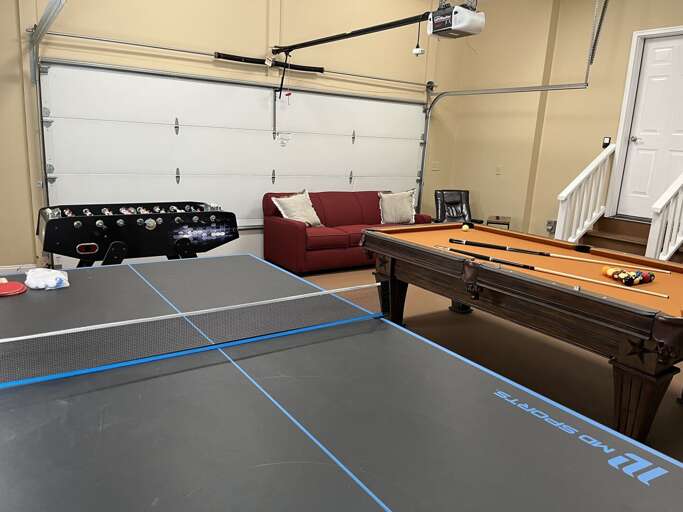 Game room with sleeper sofa.  Accessed off kitchen