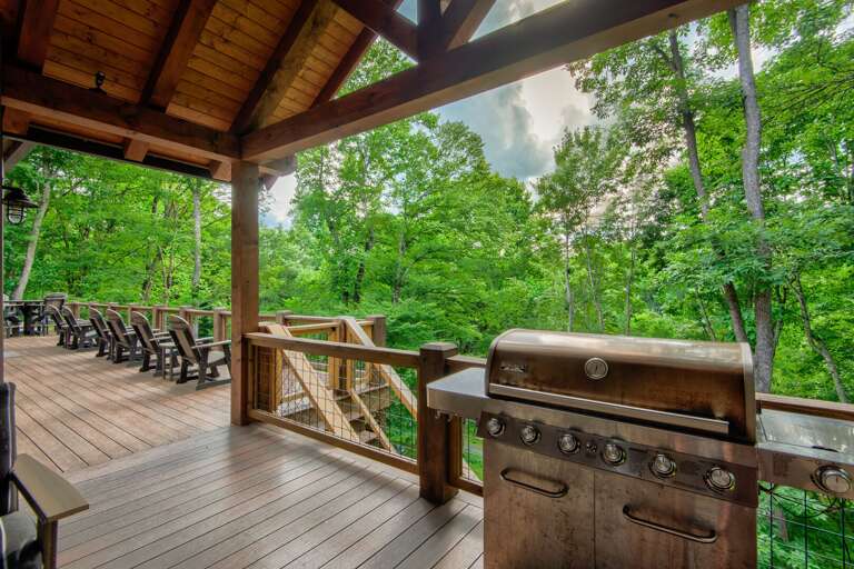 Gather outside under the vaulted timber-covered deck, where a gas grill and cozy seating overlook the Blue Ridge tree line.