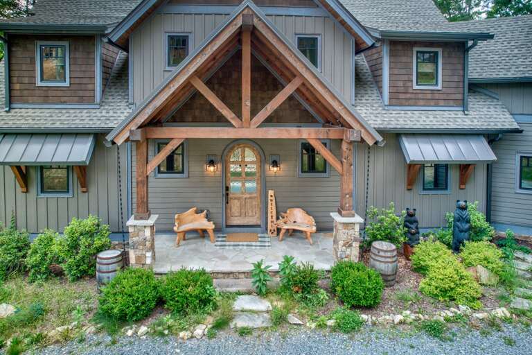 A grand timber-frame entry sets the tone at Triple Bear Lodge At Eagles Nest, where carved bear sculptures welcome your crew to the Blue Ridge Mountains.