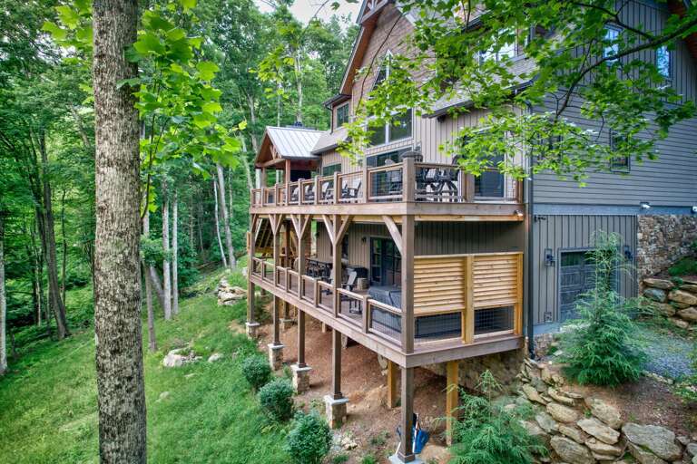 Tucked into the trees at Eagles Nest, Triple Bear Lodge offers multi-level decks and a covered hot tub ready for your crew.