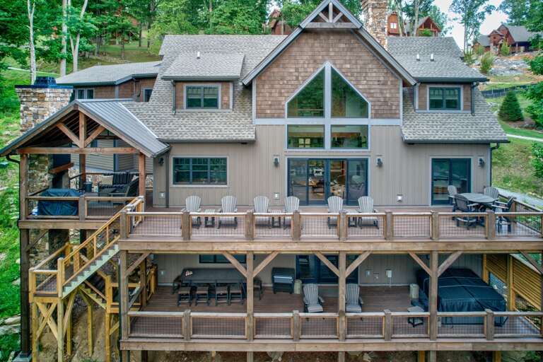 Tucked into the wooded slopes of Eagles Nest, Triple Bear Lodge rises across multiple levels with sweeping decks built for gathering.